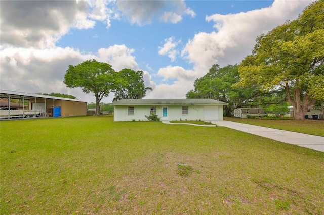 9210 Lehall Sq W, Lakeland, FL 33810 - view of front of house with concrete driveway, a garage, a front yard, and stucco siding
