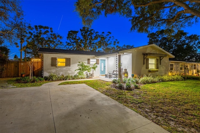1543 Gentry St, Clearwater, FL 33755 - ranch-style house with stucco siding, a front yard, and fence
