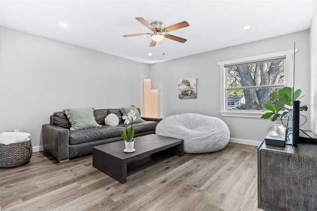 1543 Gentry St, Clearwater, FL 33755 - living room featuring a ceiling fan, baseboards, recessed lighting, and light wood-style floors
