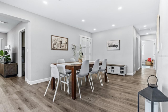 1543 Gentry St, Clearwater, FL 33755 - dining area featuring recessed lighting, baseboards, wood finished floors, and visible vents