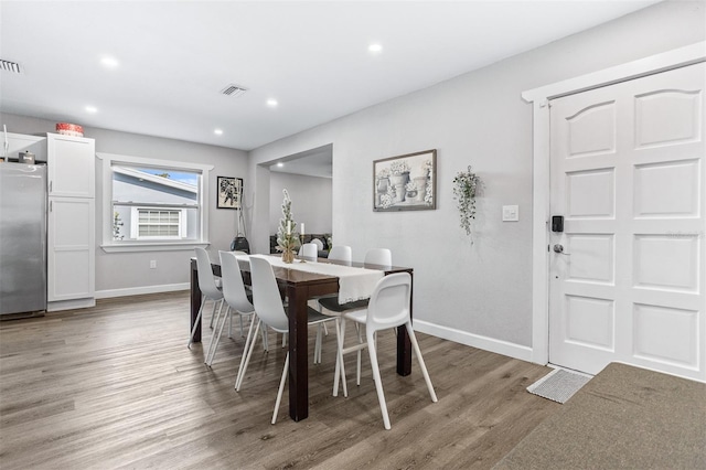 1543 Gentry St, Clearwater, FL 33755 - dining room featuring recessed lighting, baseboards, visible vents, and light wood finished floors