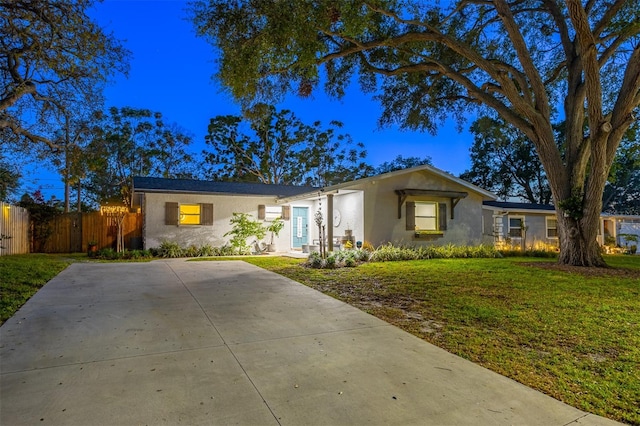 1543 Gentry St, Clearwater, FL 33755 - single story home with stucco siding, a front yard, and fence