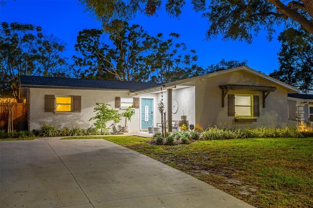 1543 Gentry St, Clearwater, FL 33755 - ranch-style home featuring fence, stucco siding, and a front yard