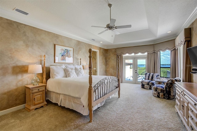 bedroom with a raised ceiling, light carpet, a textured ceiling, access to outside, and visible vents