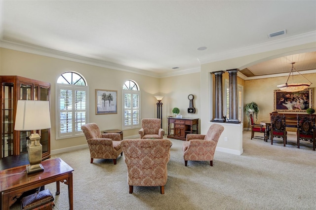 living area featuring decorative columns, carpet flooring, ornamental molding, baseboards, and visible vents
