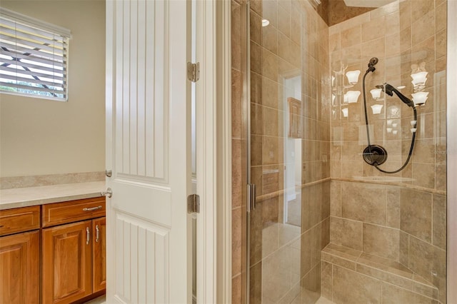 full bath with vanity and a shower stall