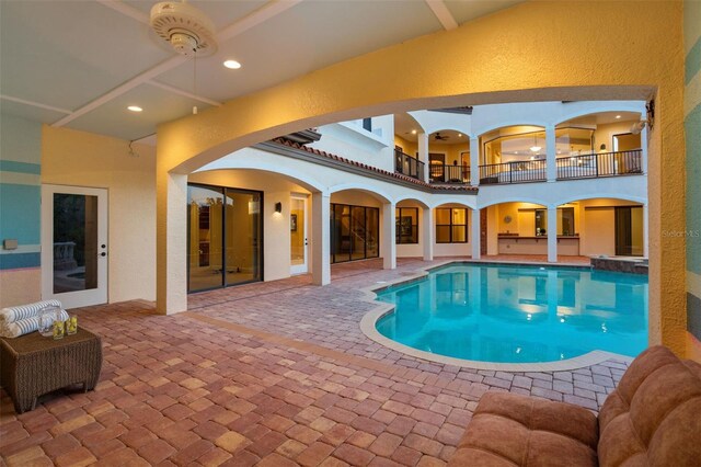 outdoor pool with a patio