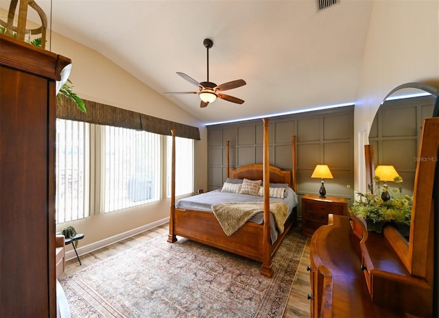 bedroom featuring wood finished floors, visible vents, ceiling fan, and vaulted ceiling