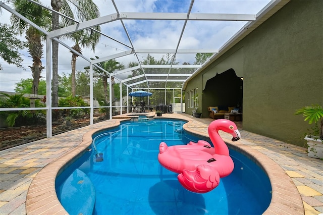 view of swimming pool with a lanai, a patio, and a pool with connected hot tub