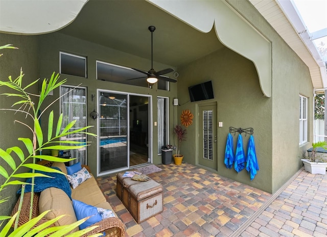 view of patio featuring ceiling fan