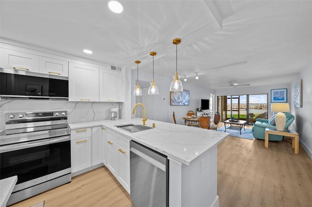 6051 Sun Blvd Unit 111, Saint Petersburg, FL 33715 - kitchen featuring white cabinetry, visible vents, a sink, and stainless steel appliances