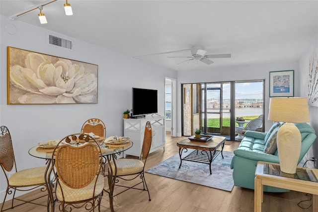 6051 Sun Blvd Unit 111, Saint Petersburg, FL 33715 - living room with a ceiling fan, light wood-style flooring, and visible vents