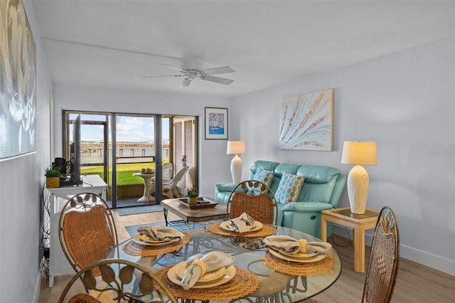 6051 Sun Blvd Unit 111, Saint Petersburg, FL 33715 - dining space featuring light wood finished floors, baseboards, and a ceiling fan