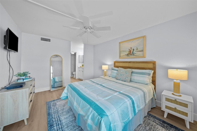 6051 Sun Blvd Unit 111, Saint Petersburg, FL 33715 - bedroom with visible vents, light wood finished floors, baseboards, a ceiling fan, and ensuite bath