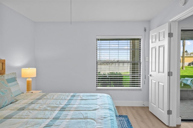 6051 Sun Blvd Unit 111, Saint Petersburg, FL 33715 - bedroom with baseboards and wood finished floors