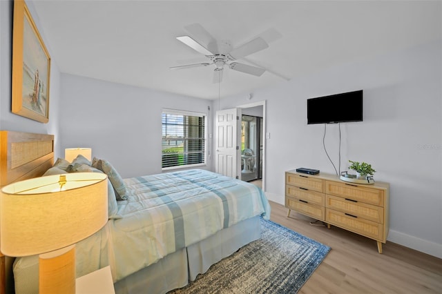 6051 Sun Blvd Unit 111, Saint Petersburg, FL 33715 - bedroom with baseboards, ceiling fan, and light wood-style flooring