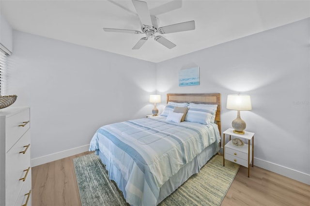 6051 Sun Blvd Unit 111, Saint Petersburg, FL 33715 - bedroom with baseboards, light wood-type flooring, and ceiling fan