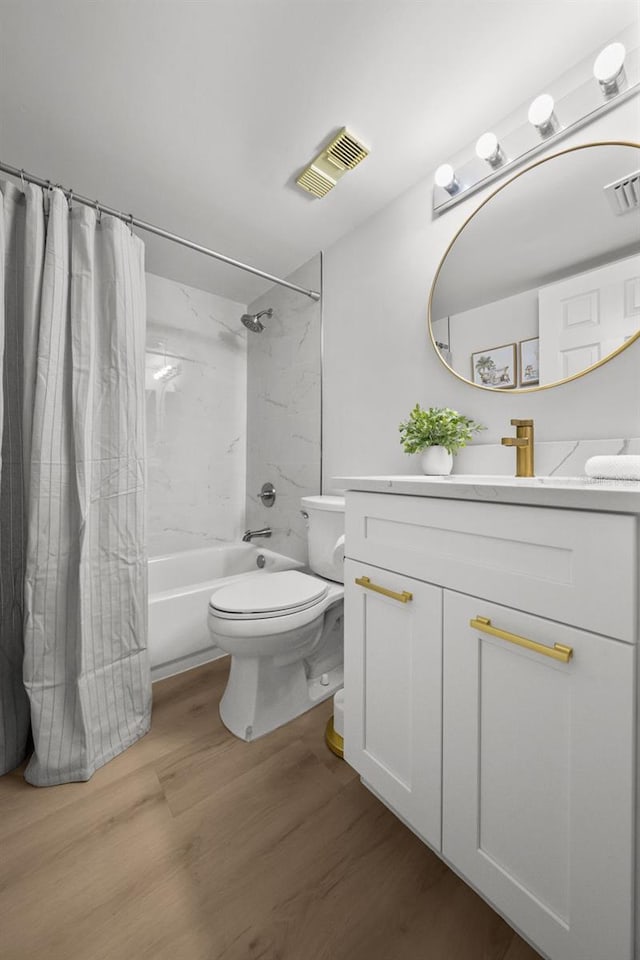 6051 Sun Blvd Unit 111, Saint Petersburg, FL 33715 - full bathroom featuring shower / tub combo with curtain, visible vents, toilet, and wood finished floors