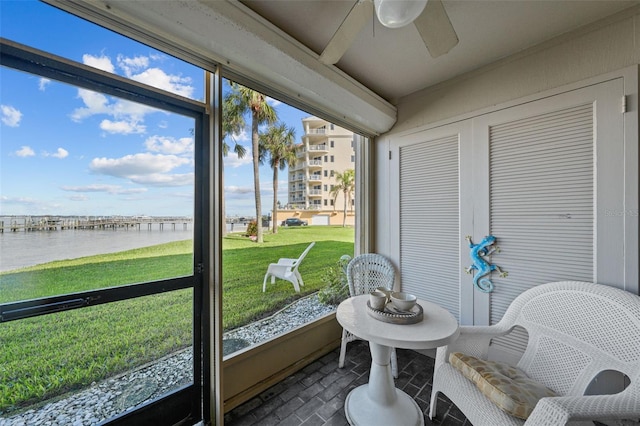 6051 Sun Blvd Unit 111, Saint Petersburg, FL 33715 - sunroom with a ceiling fan, a water view, and a healthy amount of sunlight