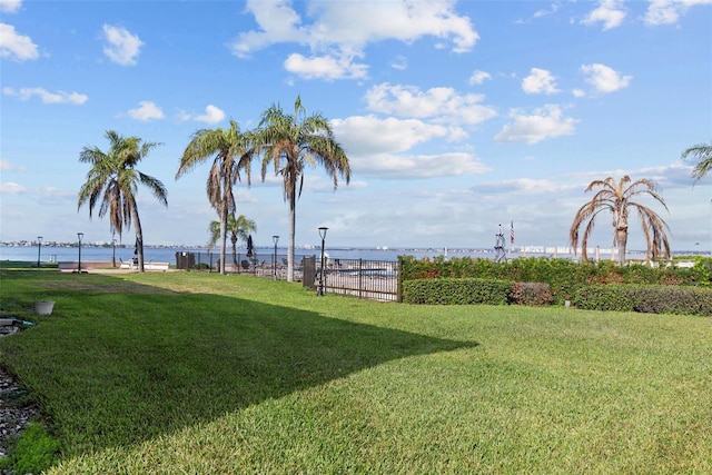6051 Sun Blvd Unit 111, Saint Petersburg, FL 33715 - view of yard featuring a water view and fence