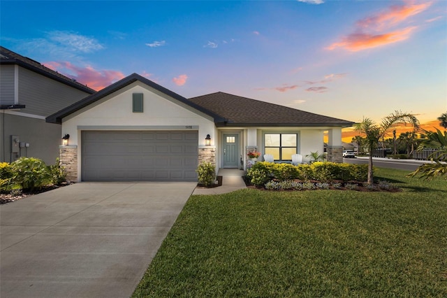 5938 164th Ave E, Parrish, FL 34219 - single story home with stucco siding, an attached garage, a lawn, and concrete driveway