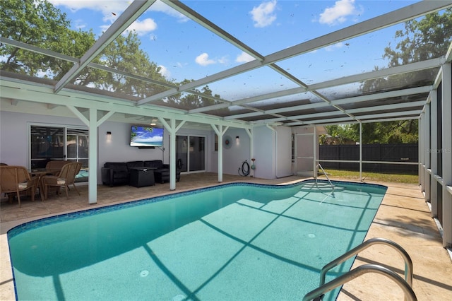11368 93rd St, Largo, FL 33773 - swimming pool featuring a patio, outdoor lounge area, and glass enclosure
