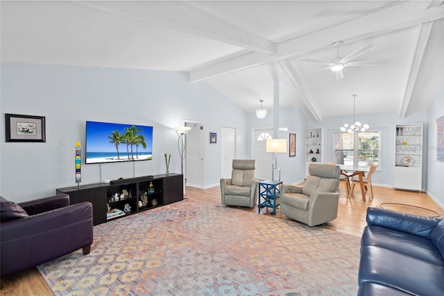 11368 93rd St, Largo, FL 33773 - living room with a chandelier, wood finished floors, and ceiling fan