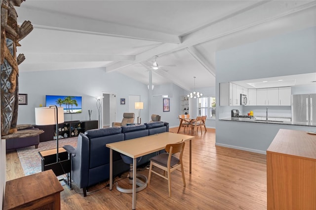 11368 93rd St, Largo, FL 33773 - living area with light wood-type flooring, a chandelier, and a ceiling fan