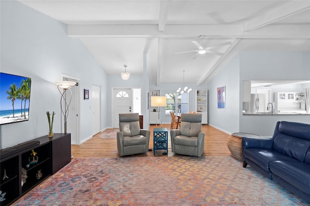 11368 93rd St, Largo, FL 33773 - living room featuring wood finished floors, a chandelier, and ceiling fan