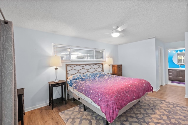 11368 93rd St, Largo, FL 33773 - bedroom with wood finished floors, a textured ceiling, and ceiling fan