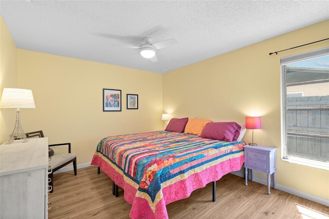 11368 93rd St, Largo, FL 33773 - bedroom featuring light wood-style floors, ceiling fan, and a textured ceiling