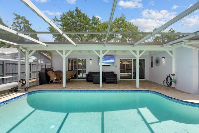 11368 93rd St, Largo, FL 33773 - view of swimming pool featuring grilling area, an outdoor hangout area, a patio area, and glass enclosure