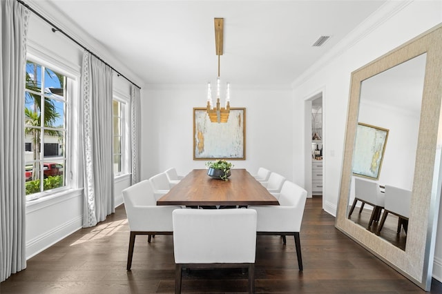 5025 W Homer Ave, Tampa, FL 33629 - dining space featuring dark wood finished floors, ornamental molding, visible vents, baseboards, and a notable chandelier