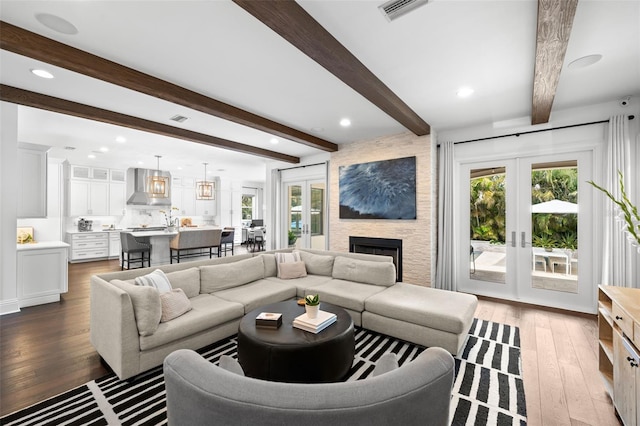 5025 W Homer Ave, Tampa, FL 33629 - living room featuring a wealth of natural light, wood-type flooring, french doors, and visible vents