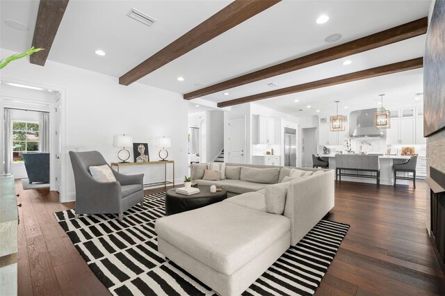 5025 W Homer Ave, Tampa, FL 33629 - living room with visible vents, beam ceiling, stairs, and dark wood finished floors