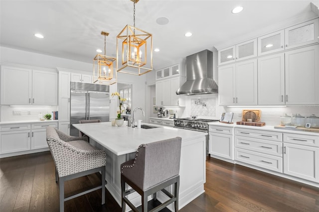 5025 W Homer Ave, Tampa, FL 33629 - kitchen featuring tasteful backsplash, an inviting chandelier, wall chimney exhaust hood, a sink, and high end appliances