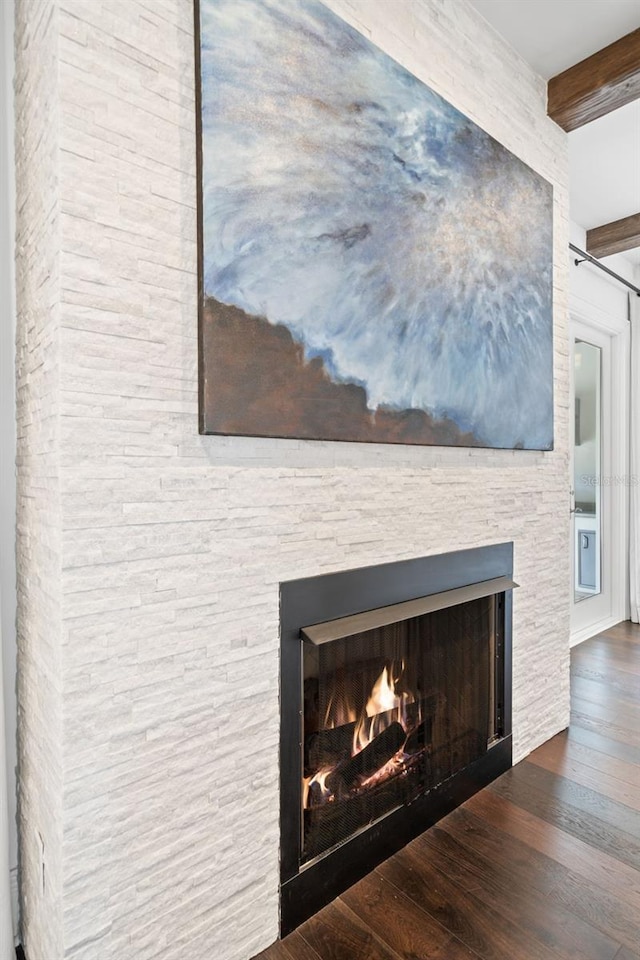 5025 W Homer Ave, Tampa, FL 33629 - interior details featuring beam ceiling, a stone fireplace, and wood finished floors