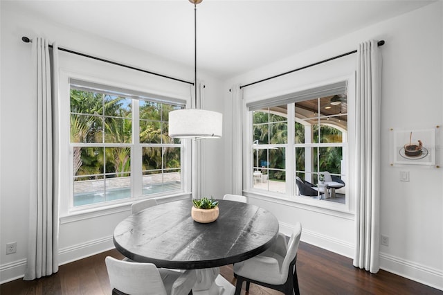 5025 W Homer Ave, Tampa, FL 33629 - dining room featuring baseboards and dark wood finished floors
