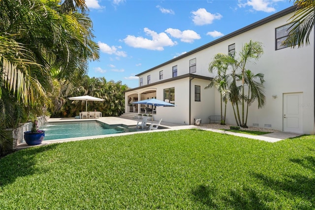 5025 W Homer Ave, Tampa, FL 33629 - back of house with an outdoor pool, a patio, a yard, and stucco siding