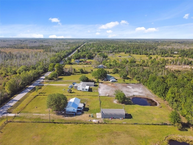aerial view featuring a rural view and a forest view