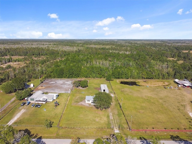aerial view featuring a wooded view