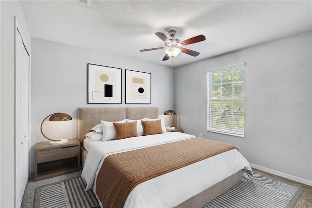 10524 White Peacock Pl, Riverview, FL 33578 - bedroom featuring carpet flooring, baseboards, a textured ceiling, and ceiling fan