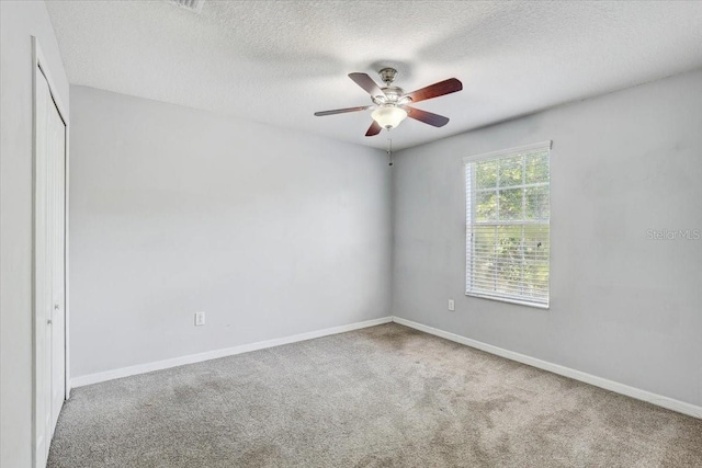 10524 White Peacock Pl, Riverview, FL 33578 - carpeted spare room featuring ceiling fan, a textured ceiling, and baseboards