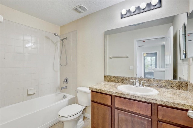 10524 White Peacock Pl, Riverview, FL 33578 - full bathroom with toilet, vanity, tub / shower combination, a textured ceiling, and baseboards
