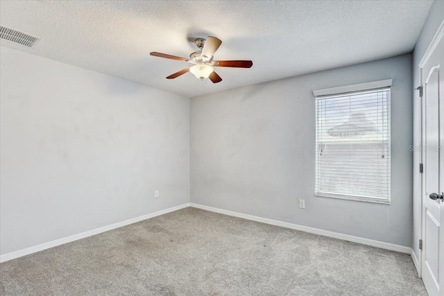 10524 White Peacock Pl, Riverview, FL 33578 - unfurnished room with carpet flooring, ceiling fan, a textured ceiling, and baseboards