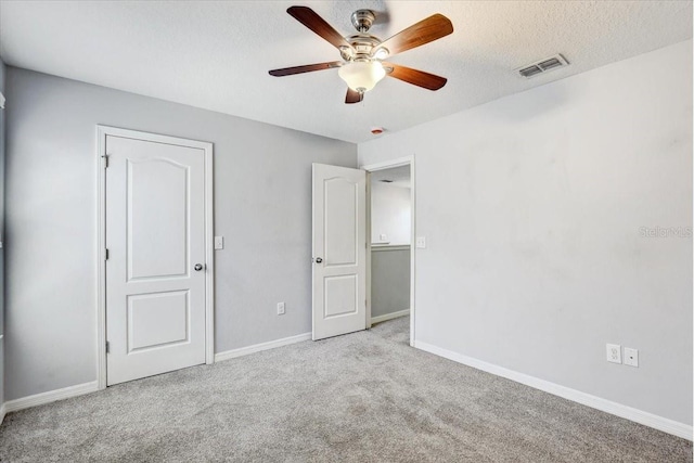 10524 White Peacock Pl, Riverview, FL 33578 - unfurnished bedroom with carpet flooring, baseboards, a ceiling fan, and a textured ceiling