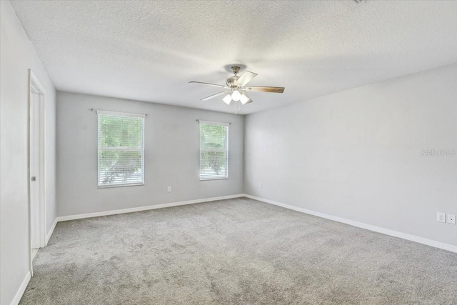 10524 White Peacock Pl, Riverview, FL 33578 - carpeted spare room featuring ceiling fan, a textured ceiling, and baseboards