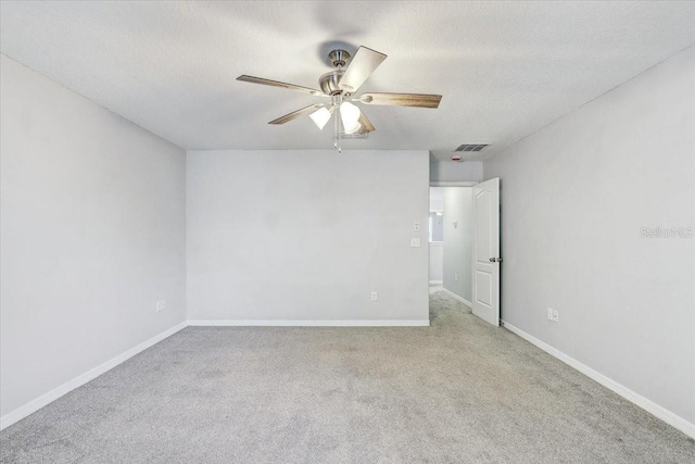 10524 White Peacock Pl, Riverview, FL 33578 - unfurnished room featuring a ceiling fan, carpet flooring, baseboards, and a textured ceiling