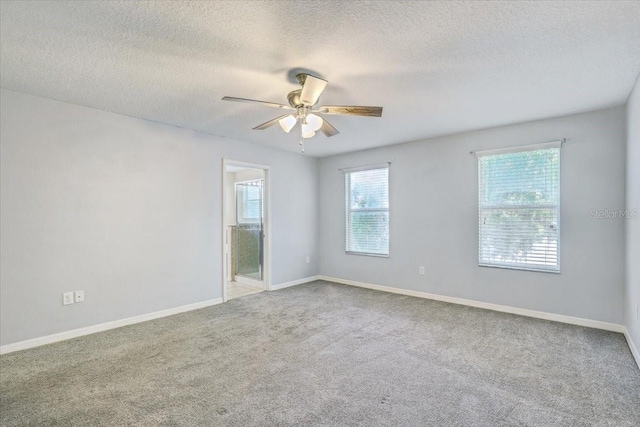 10524 White Peacock Pl, Riverview, FL 33578 - carpeted spare room featuring ceiling fan, a textured ceiling, and baseboards