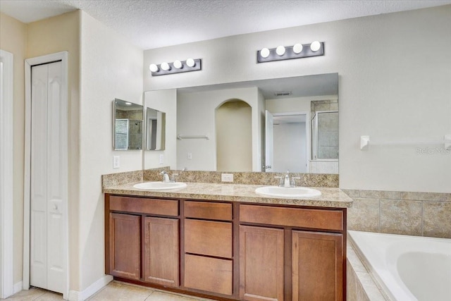 10524 White Peacock Pl, Riverview, FL 33578 - full bath with a garden tub, a closet, double vanity, a shower, and tile patterned floors